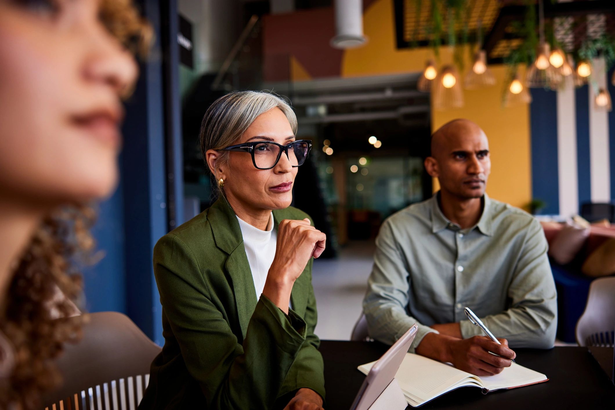 Manager listening attentively during a team meeting